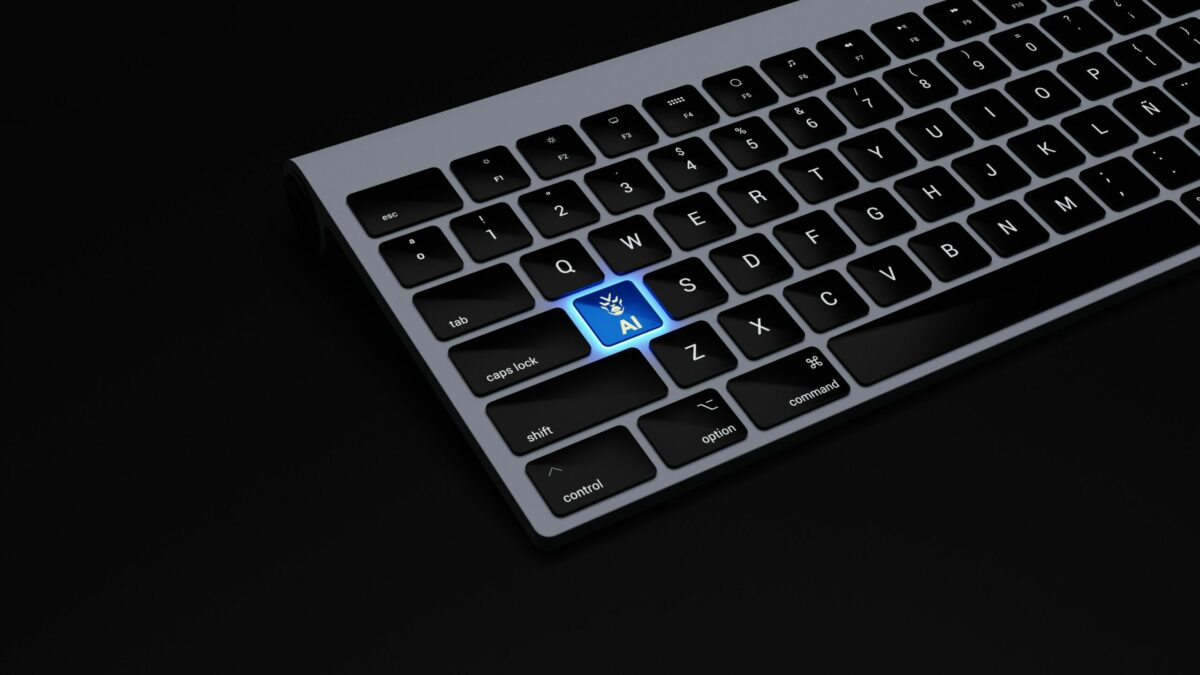 a black keyboard with a blue button on it