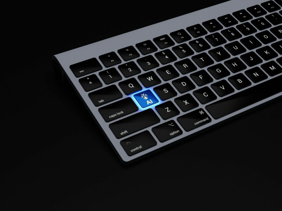 a black keyboard with a blue button on it