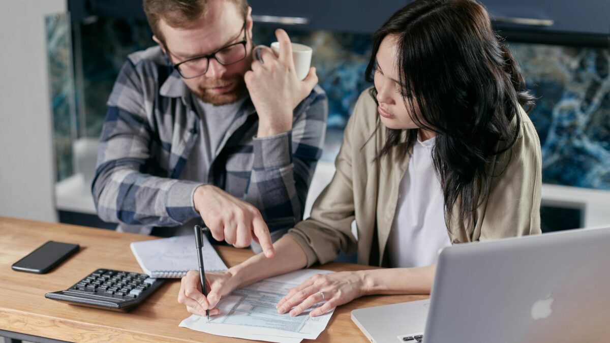 Free couple calculating al their bills stock photo